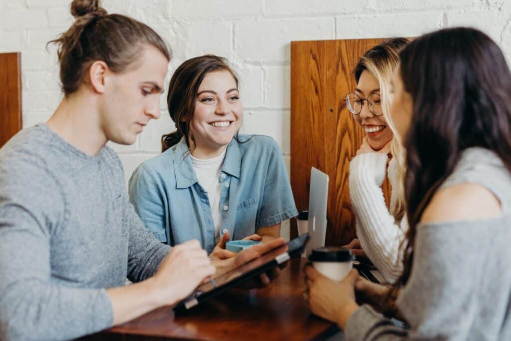 Group of teens / young adults meeting at a table